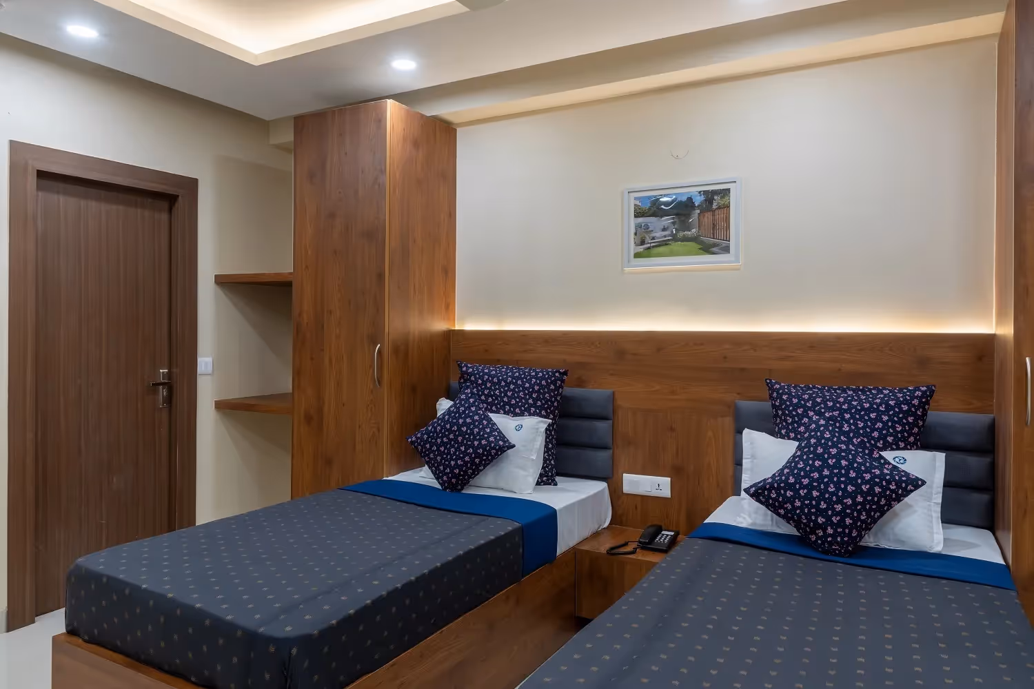 room with double beds and furniture and beds and work desk, chairs