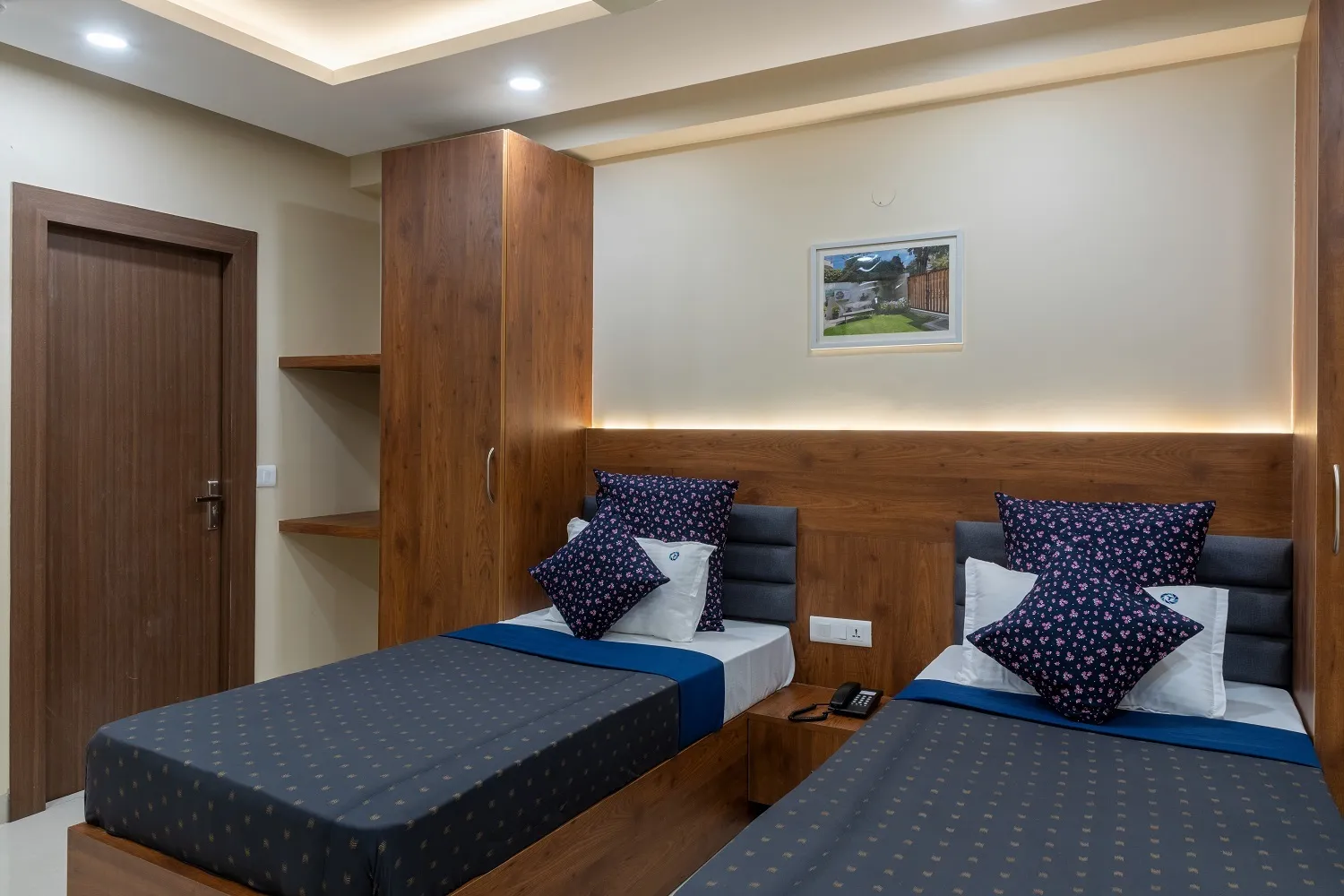 room with double beds and furniture and beds and work desk, chairs