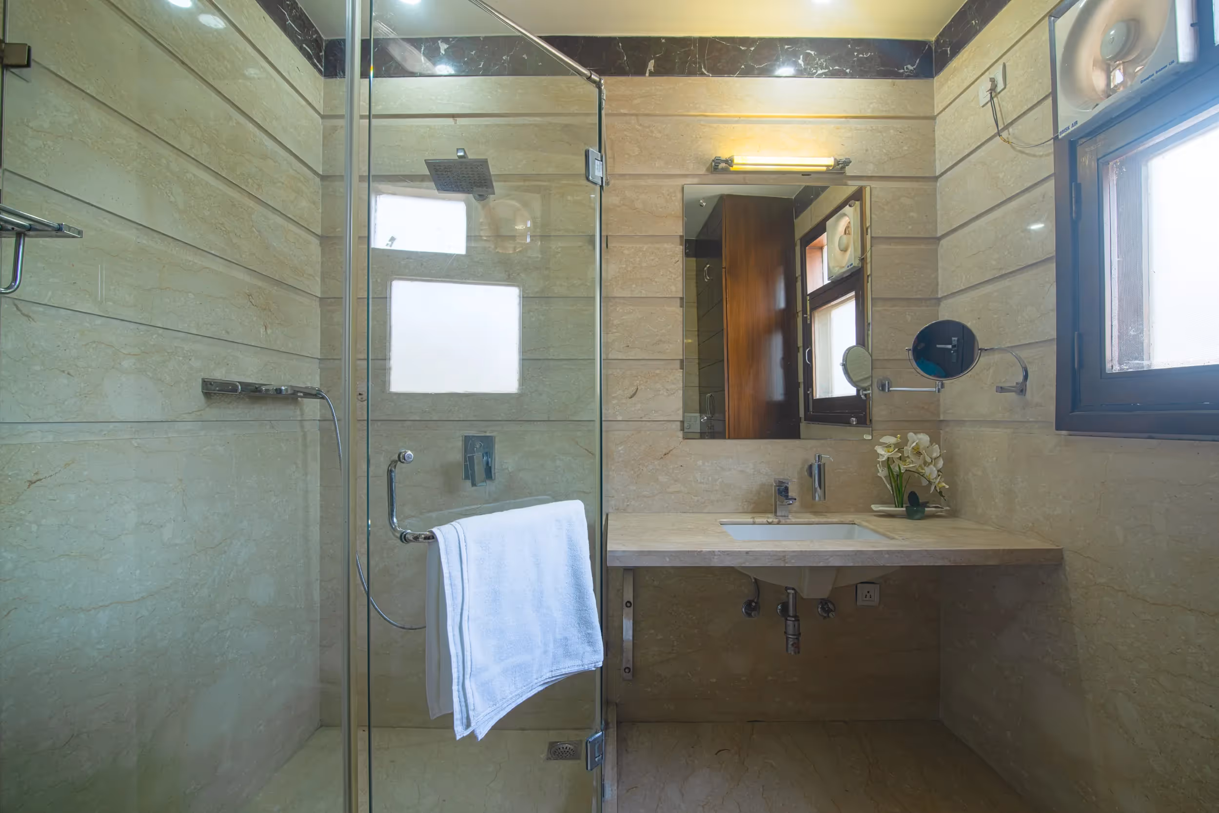 View of the apartment bathroom in the serviced studio- well done up for a single traveler or a small family