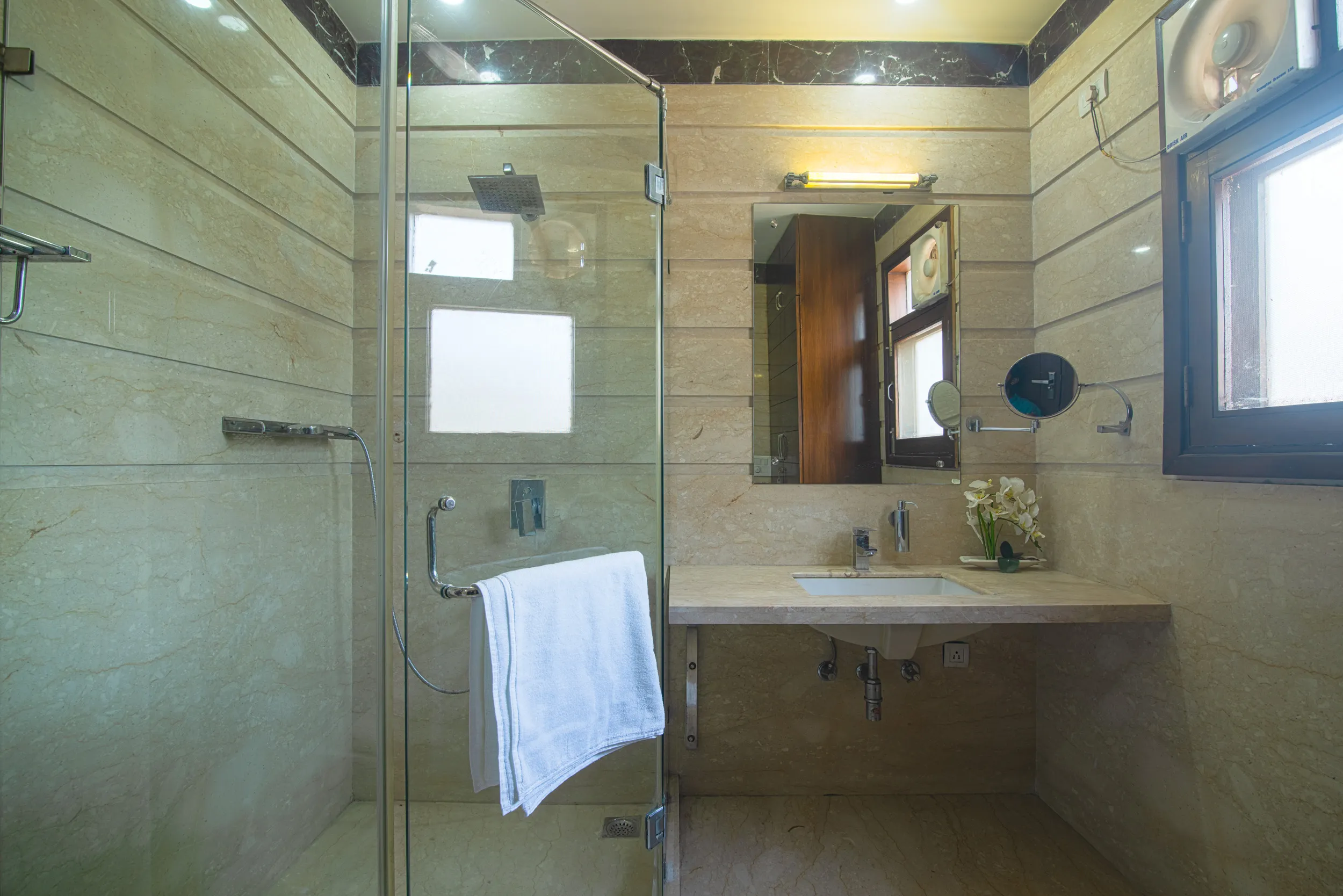 View of the apartment bathroom in the serviced studio- well done up for a single traveler or a small family