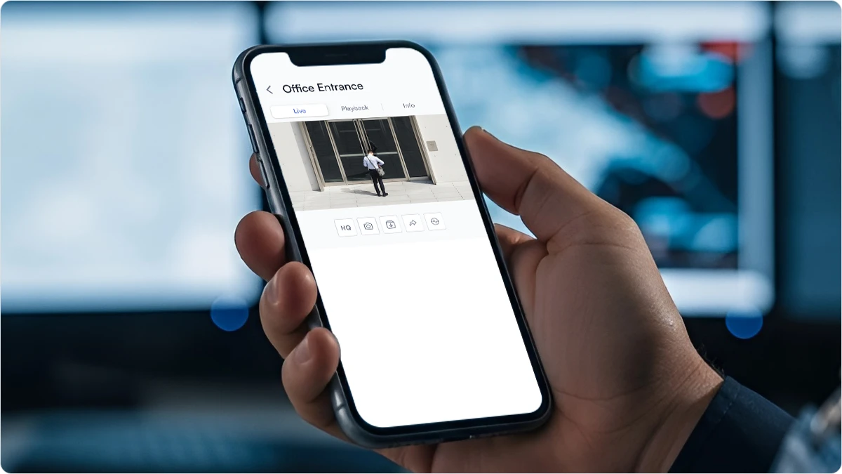 Phone screen showing a man entering a building.