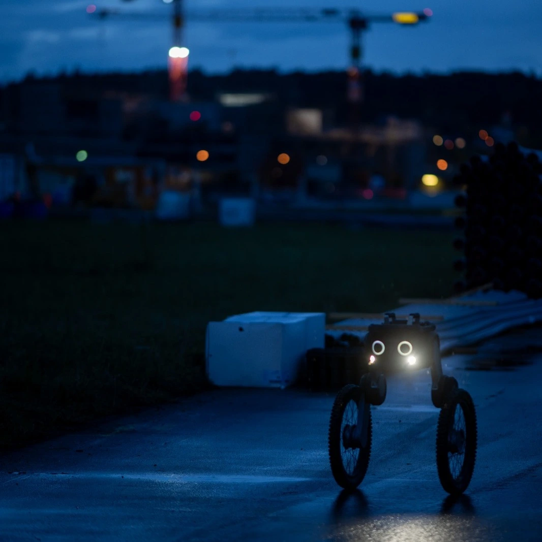 Ascento Guard security robot autonomously patrolling an outdoor site at night.