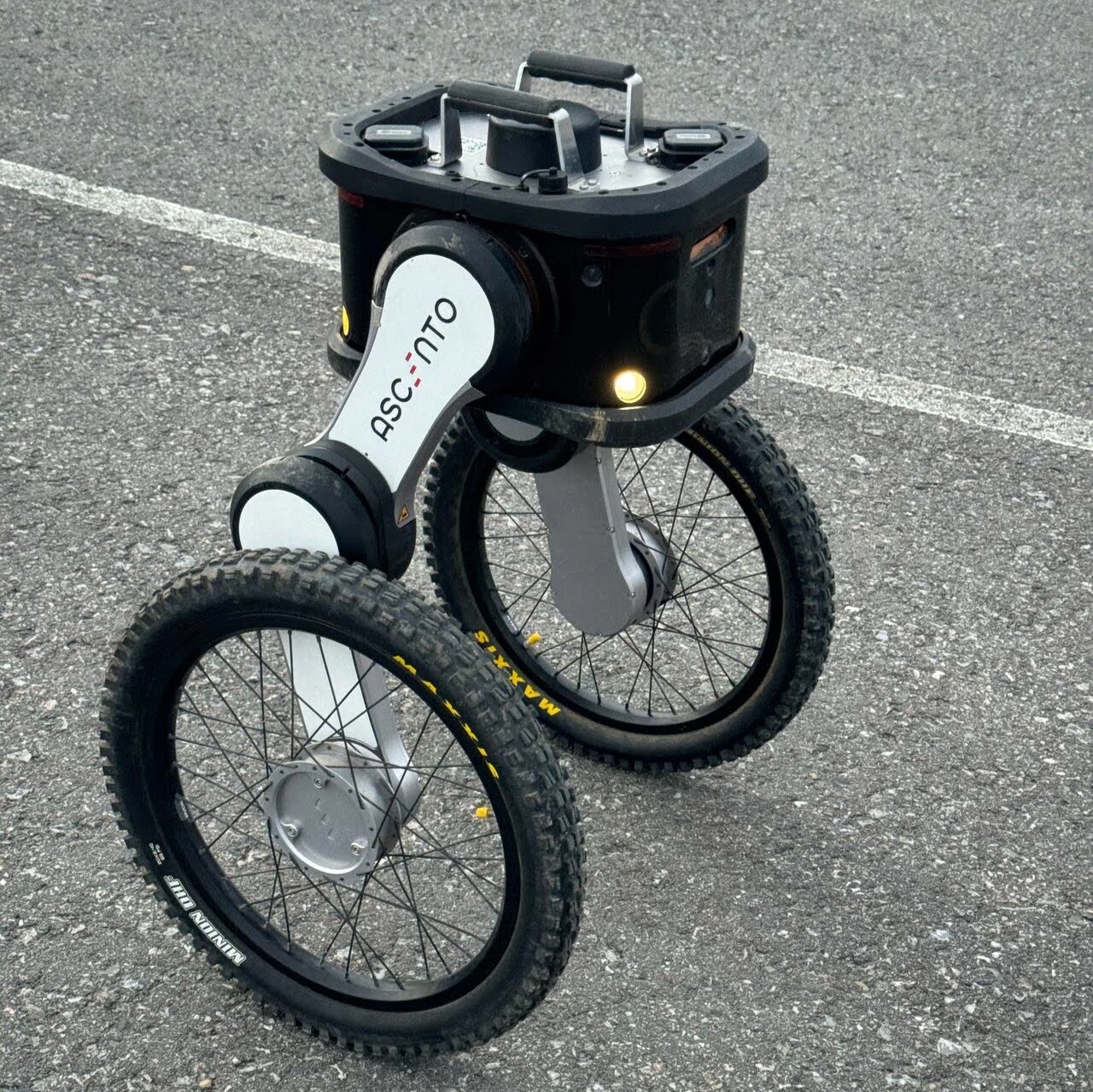 Ascento Guard outdoor security robot with wheel-leg mobility system.