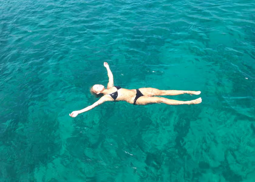 Holly Given floating in the water.