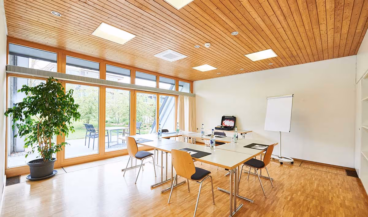 Small seminar room with seating for a small group meeting