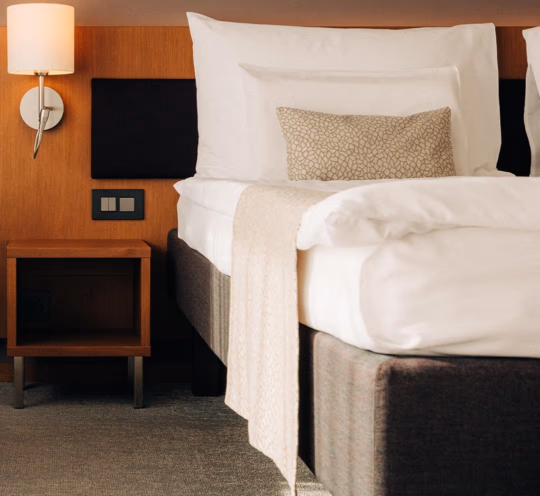 Hotel room with double bed and modern furnishings