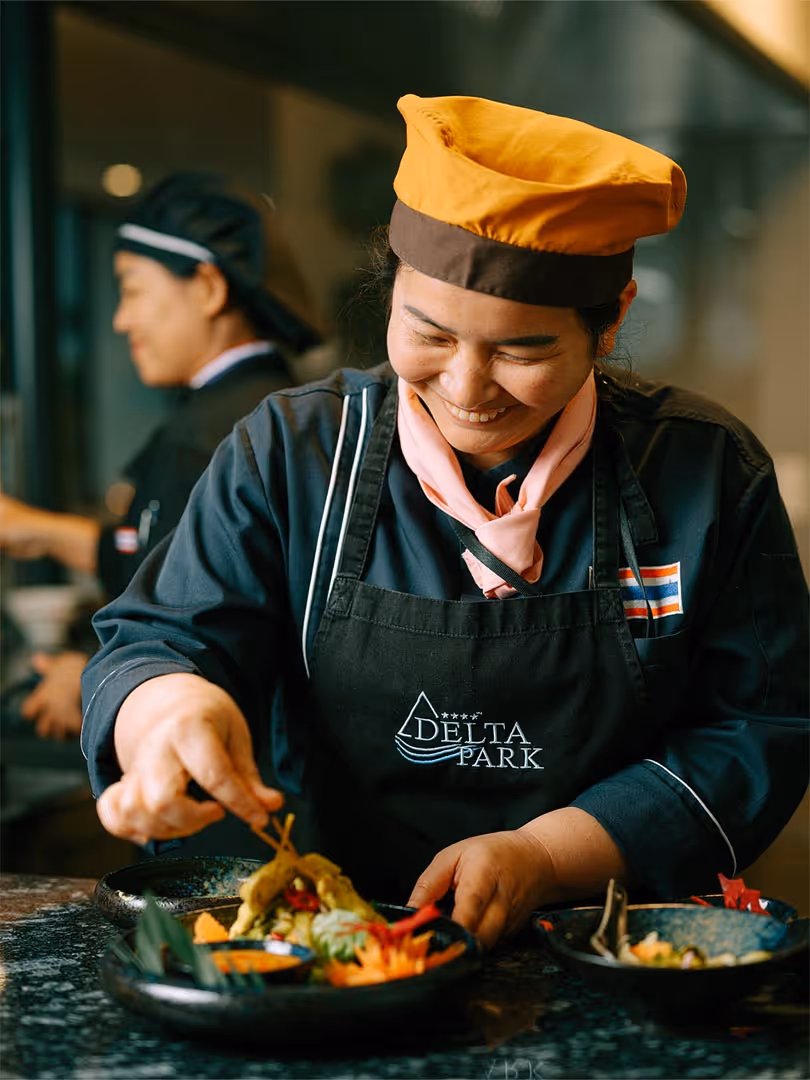 Chef prepares dish at Deltaverde Thai Cuisine restaurant