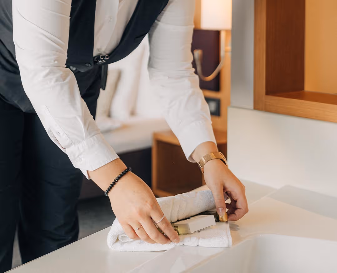 Employee places pleasant details in the hotel room of the Deltapark Vitalresort