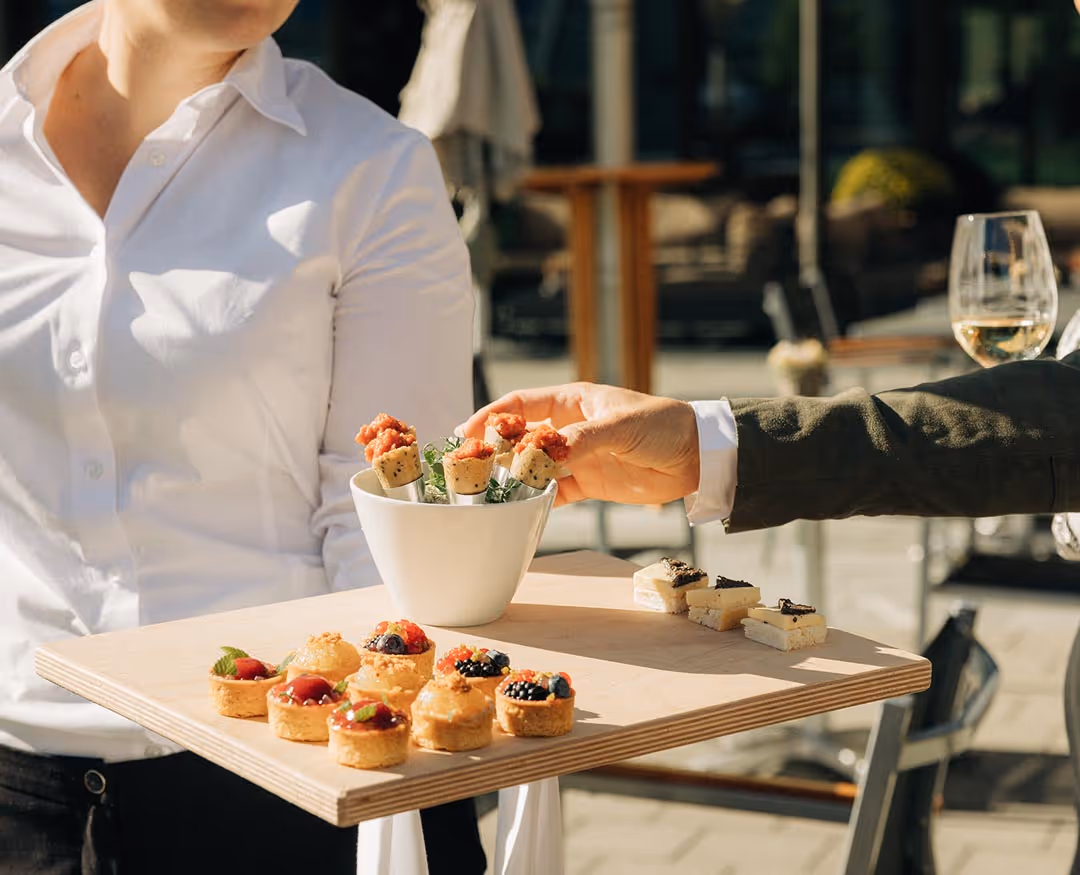 Restaurant specialist serves aperitif canapés 
