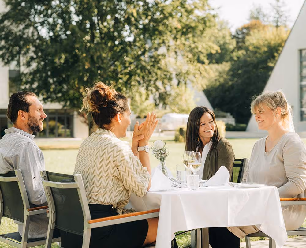 People at the table on the terrace of the Deltapark Vitalresort