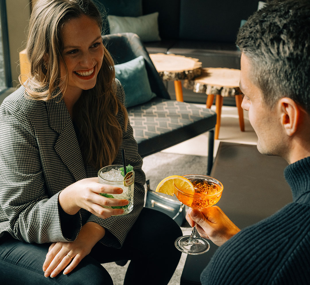 A couple enjoying a cocktail together in the Delta Lounge & Bar