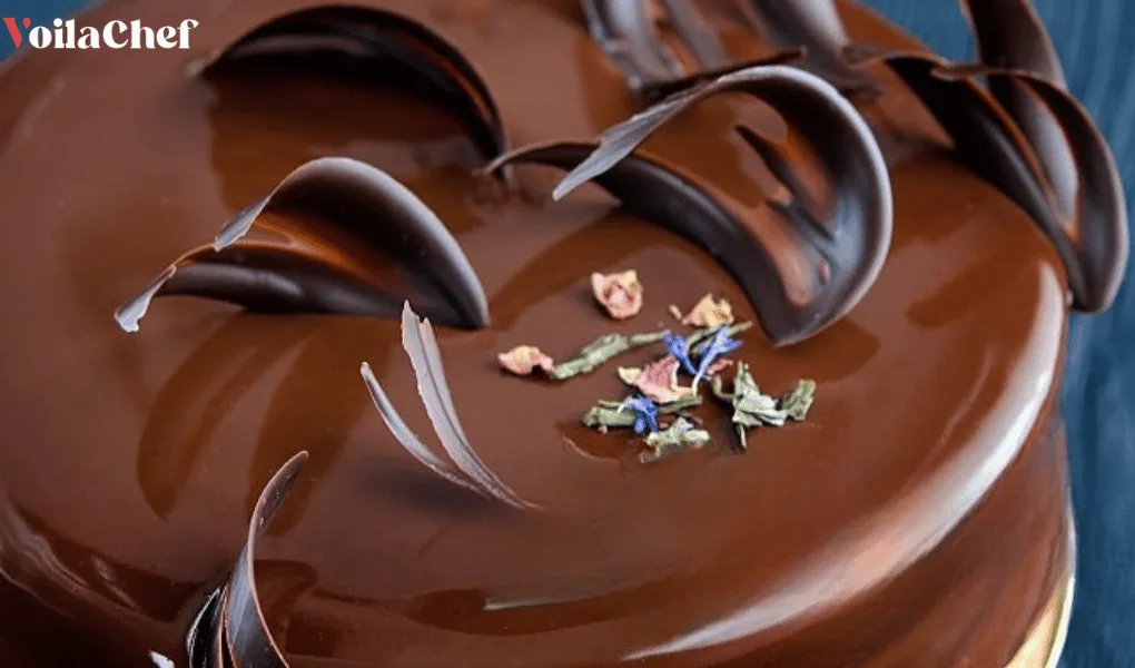 Cake covered in a glossy, smooth chocolate mirror glaze