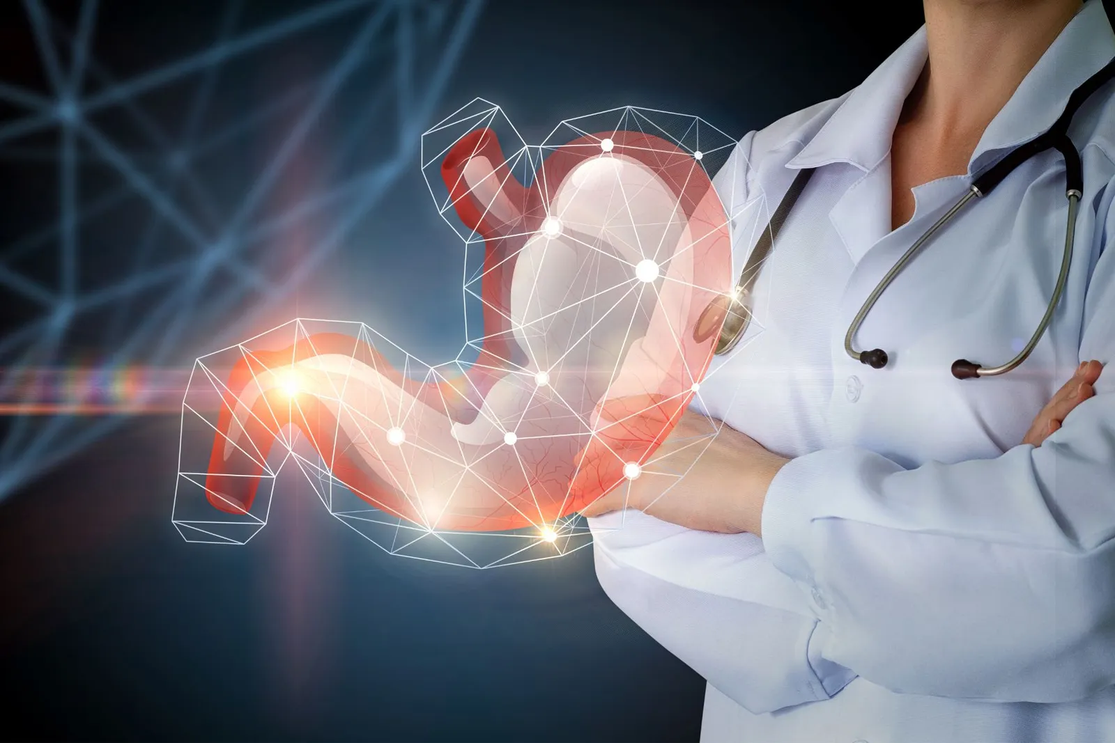 Doctor beside a digital illustration of the digestive system