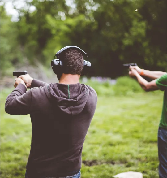 Shooters at club range with real-time attendance and notification tracking — SquadSpot