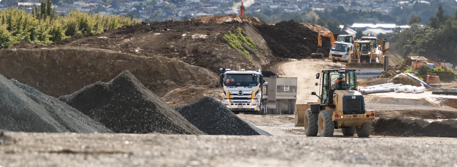 Our story - what we do at hick bros image - two workers on site next to digger