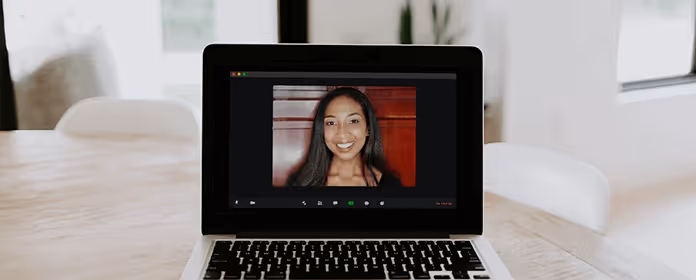 Picture of a computer with a meeting in progress