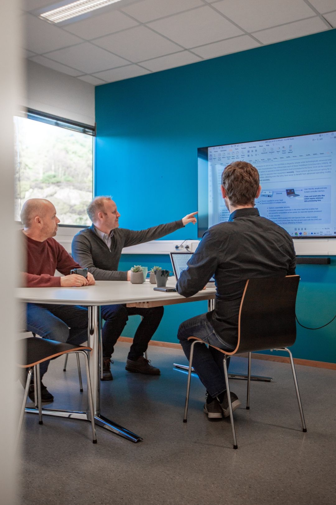 GoSubsea team discussing an equipment solution in a meeting room