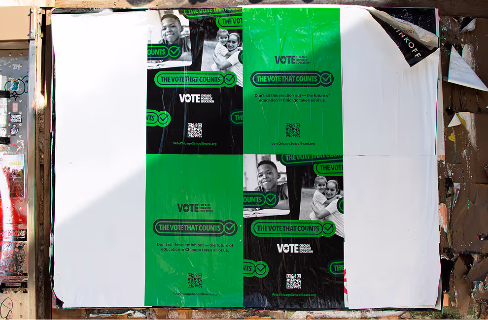 Outdoor poster torn into quadrants with black-and-green panels saying 'THE VOTE THAT COUNTS' promoting Chicago Board of Education voting, featuring QR codes and images of smiling children and adults.