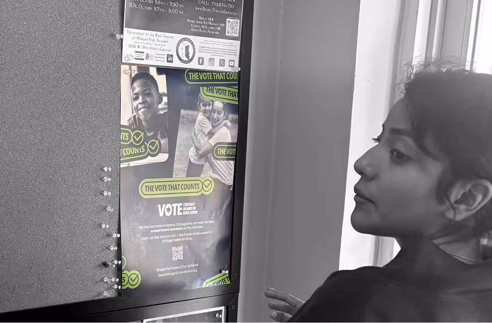 A woman looking at a bulletin board with a poster about Chicago school board elections titled 'The Vote That Counts.'