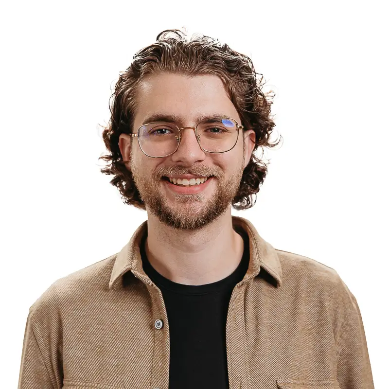 man with brown hair smiling