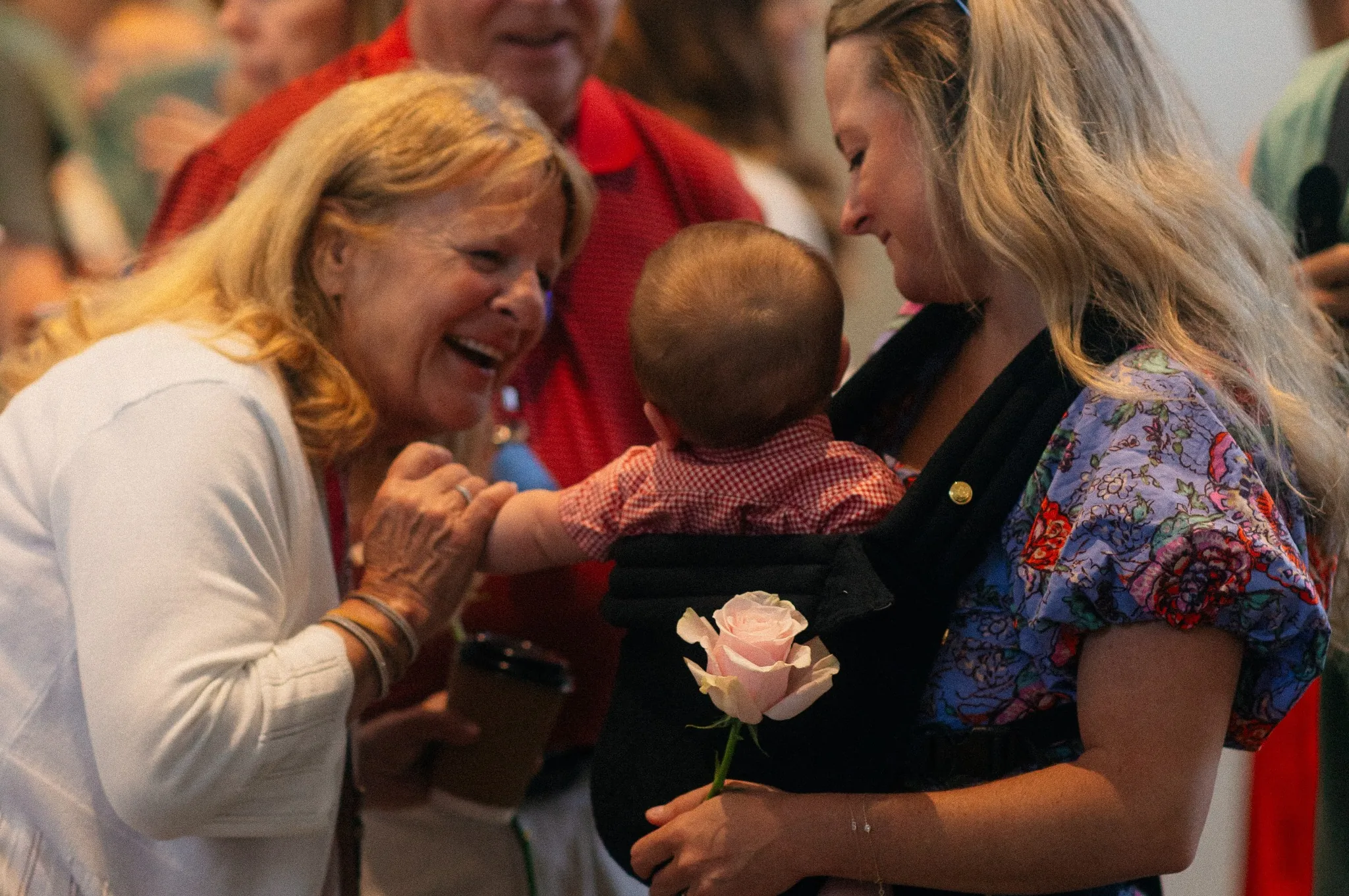 Woman smiling at child