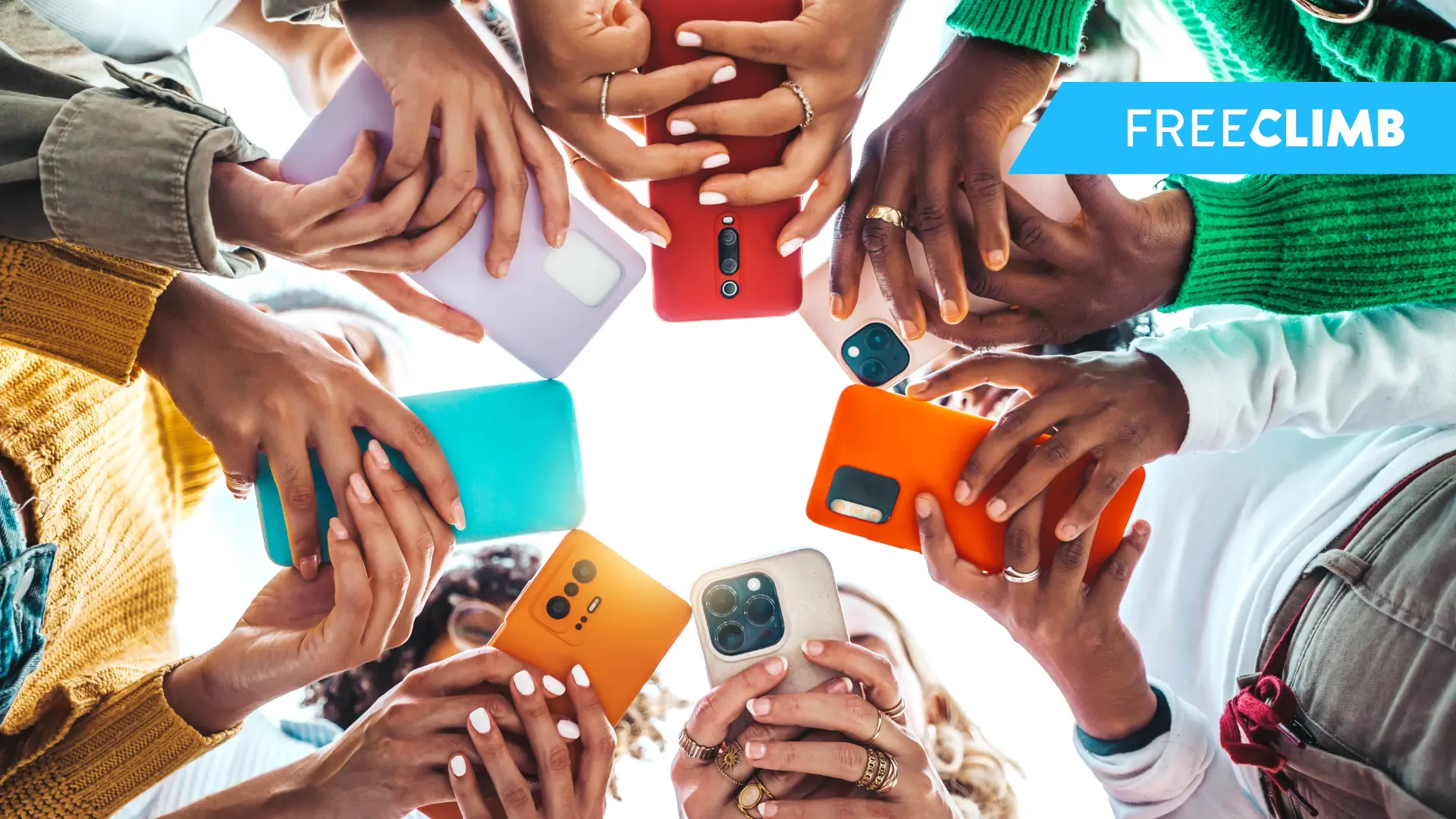 Worms eye view at a group of people standing with their cell phones out