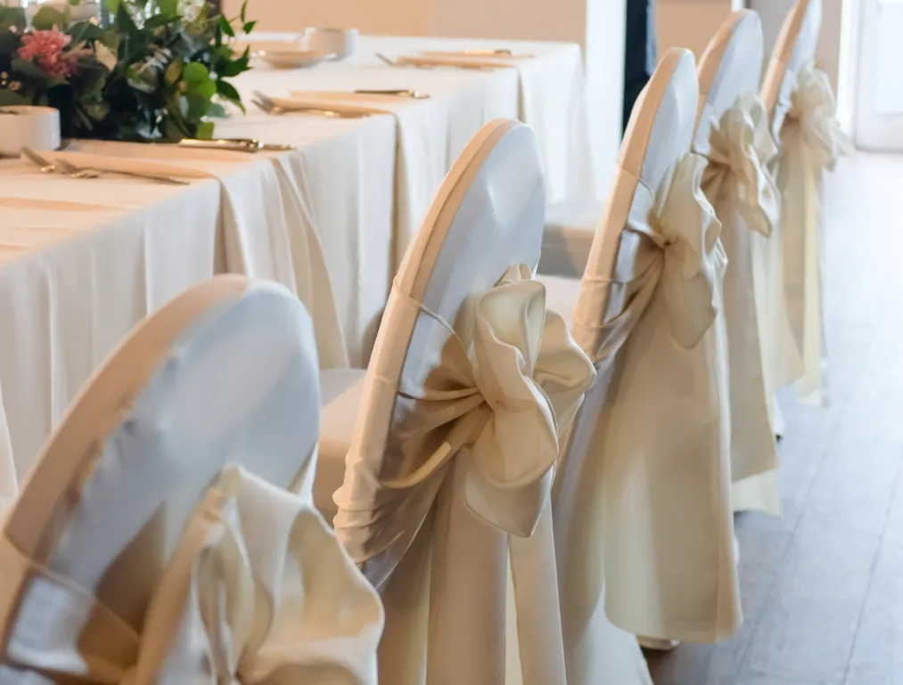 Decorated chairs at wedding reception
