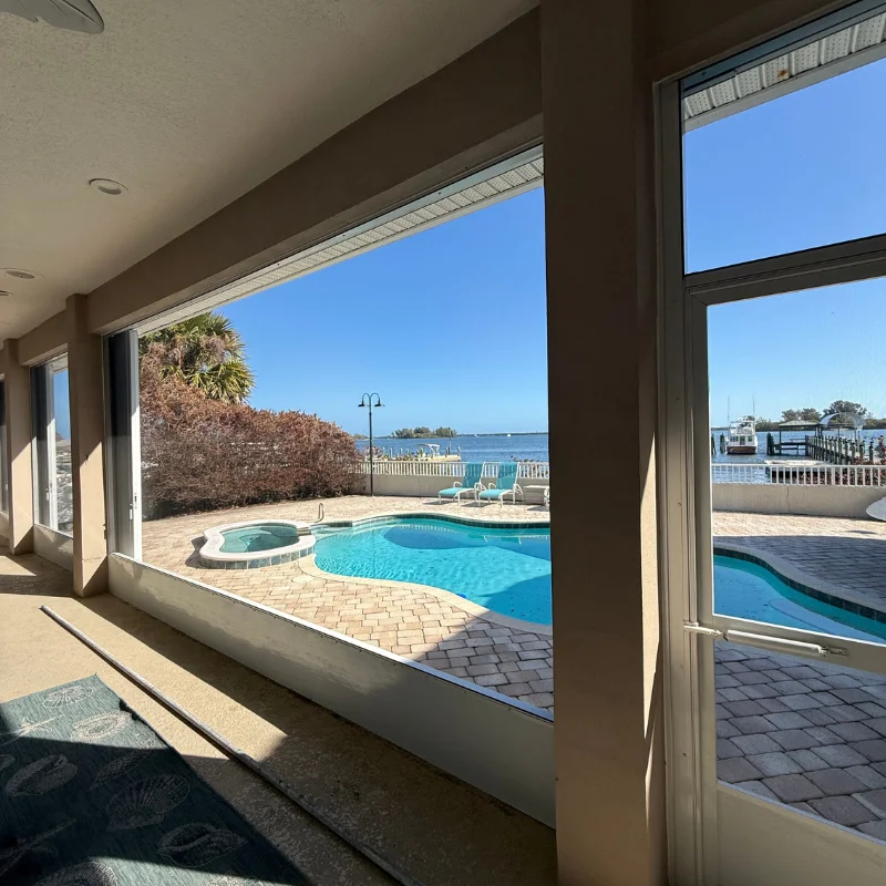 A family enjoying a bug-free afternoon inside a screened patio enclosure - screened in enclosure on a patio