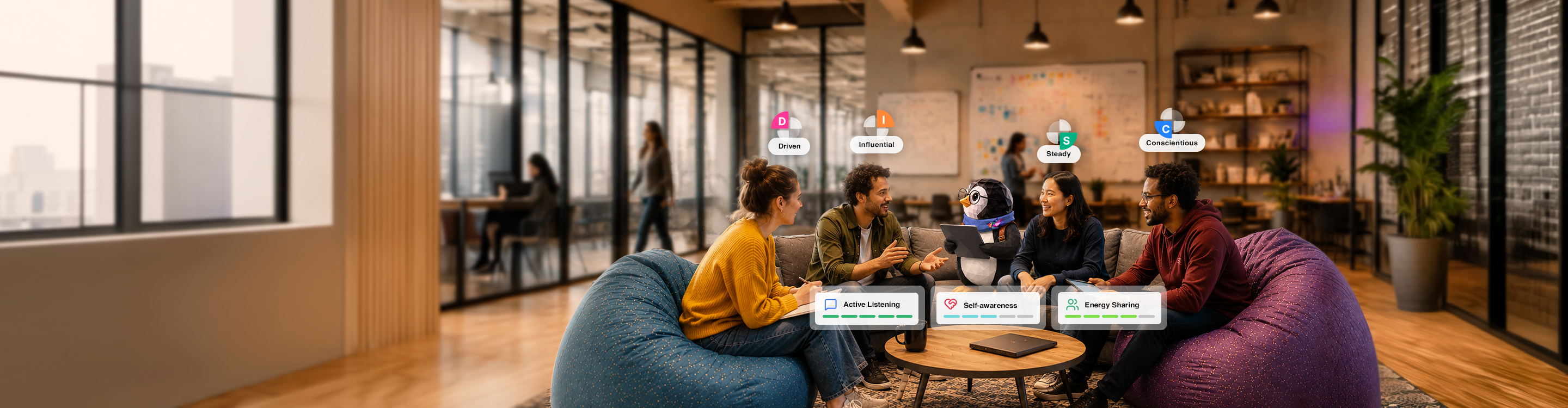 Four people and a penguin mascot sit on bean bags in a modern office having a discussion.