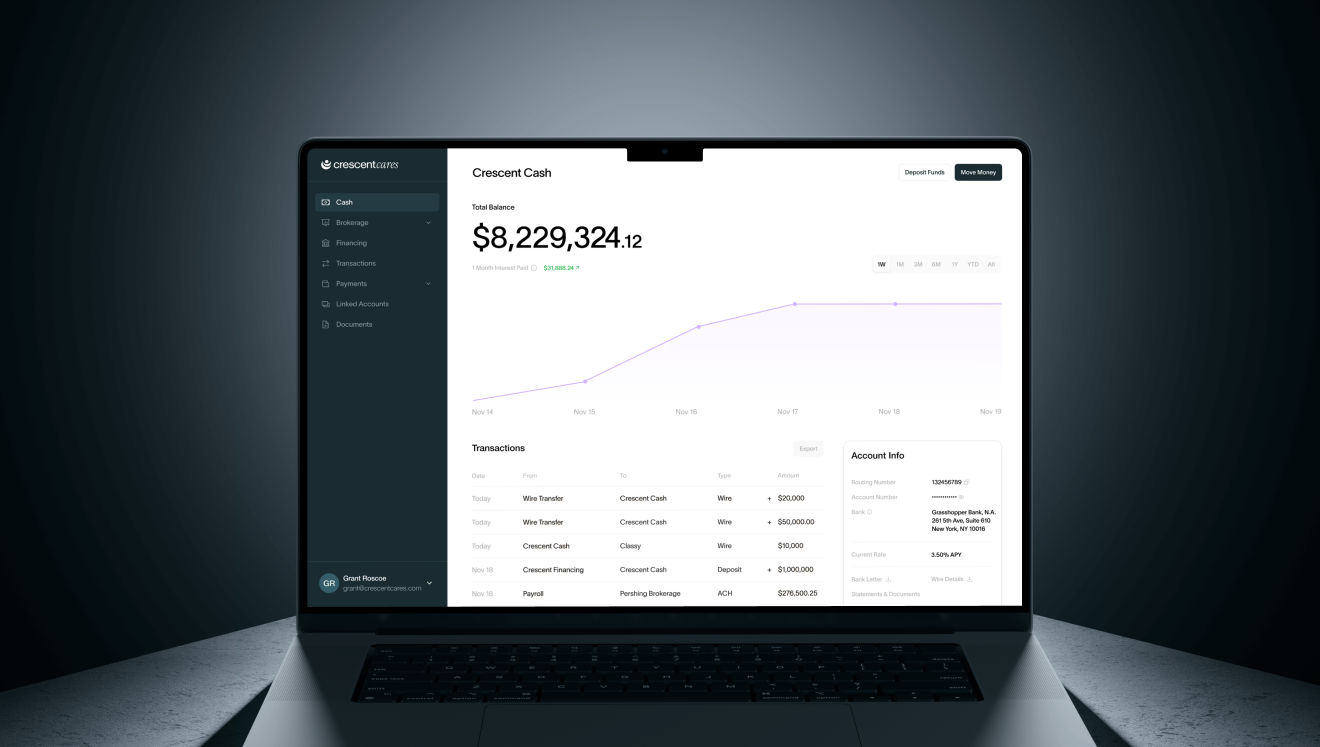 Laptop screen showing a financial dashboard with a total balance of $8,229,324.12, a purple line graph of account growth, recent transactions, and account info details.
