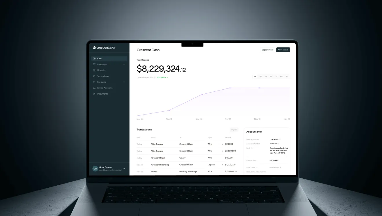 Laptop screen showing a financial dashboard with a total balance of $8,229,324.12, a purple line graph of account growth, recent transactions, and account info details.