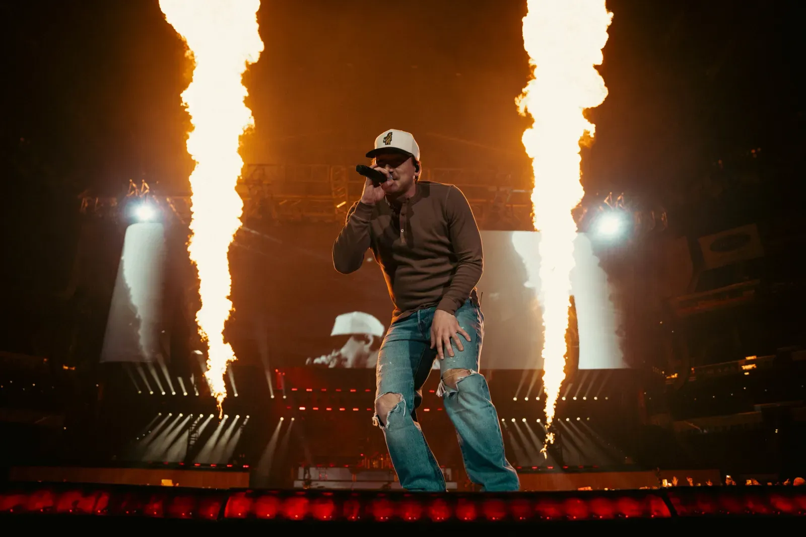 The One Night At A Time stadium stage, with the video header above the performance.