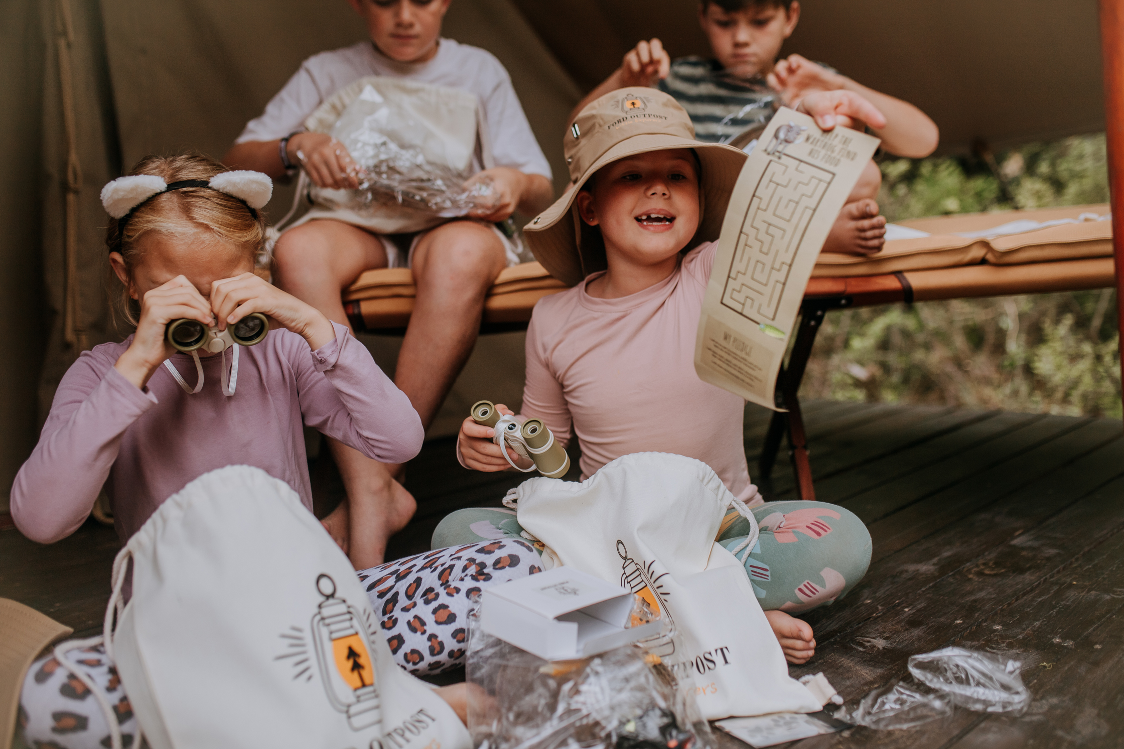 Children opening their Little Explorers Bug Bags
