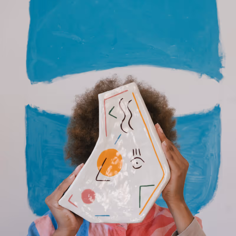 Person holding an art piece