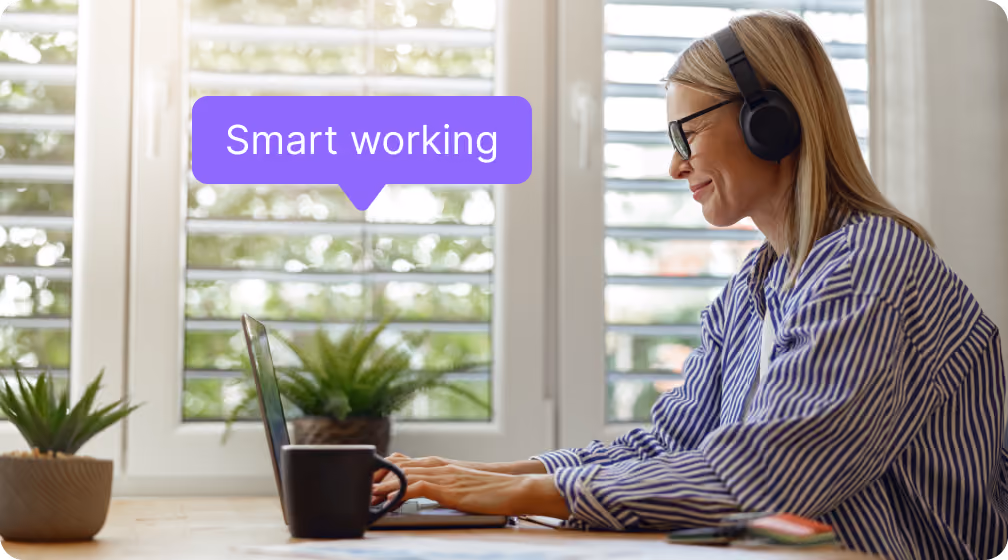 Woman working from home planning smart working with farBooking