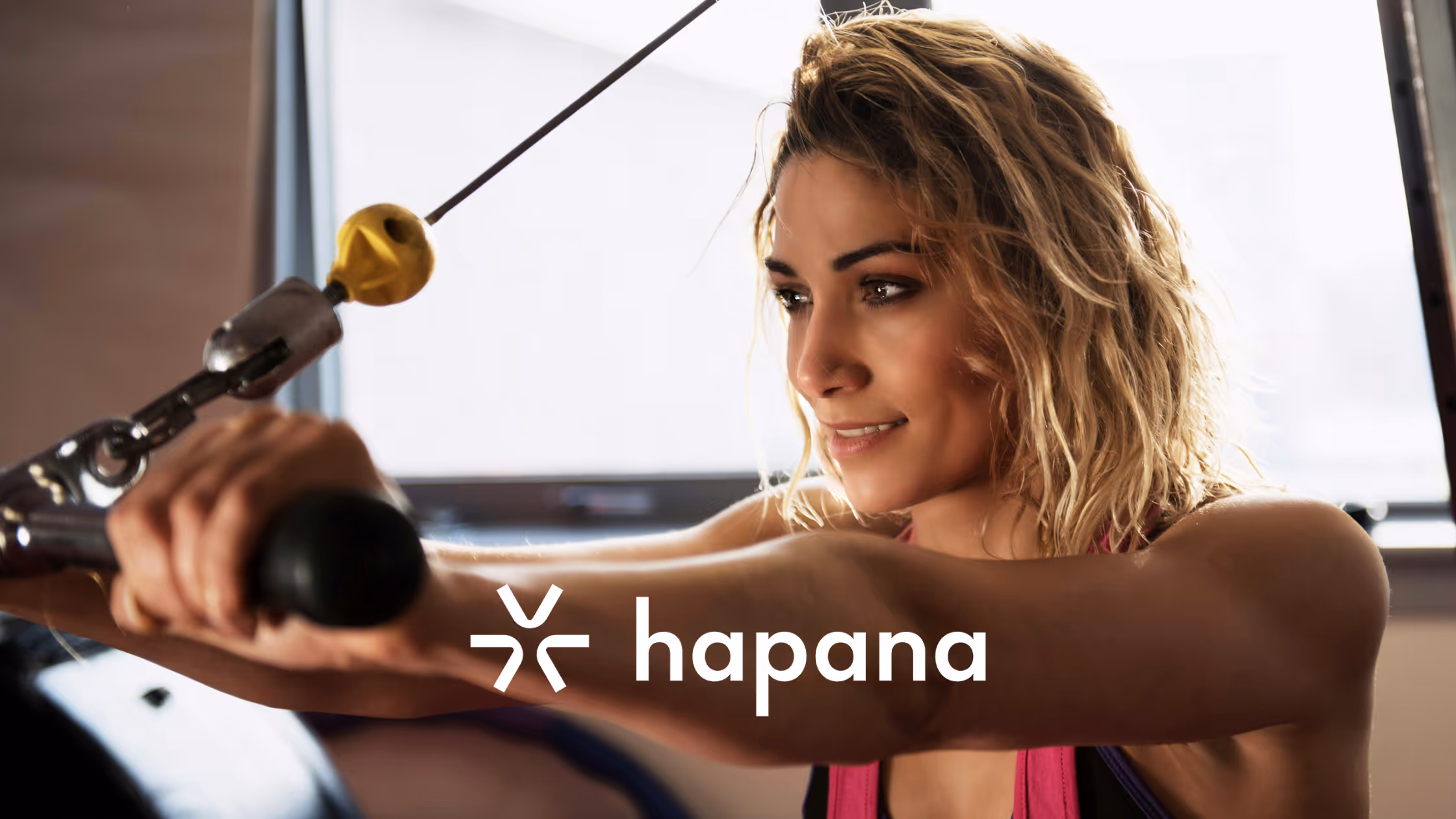Close up of gym member using upper body fitness equipment