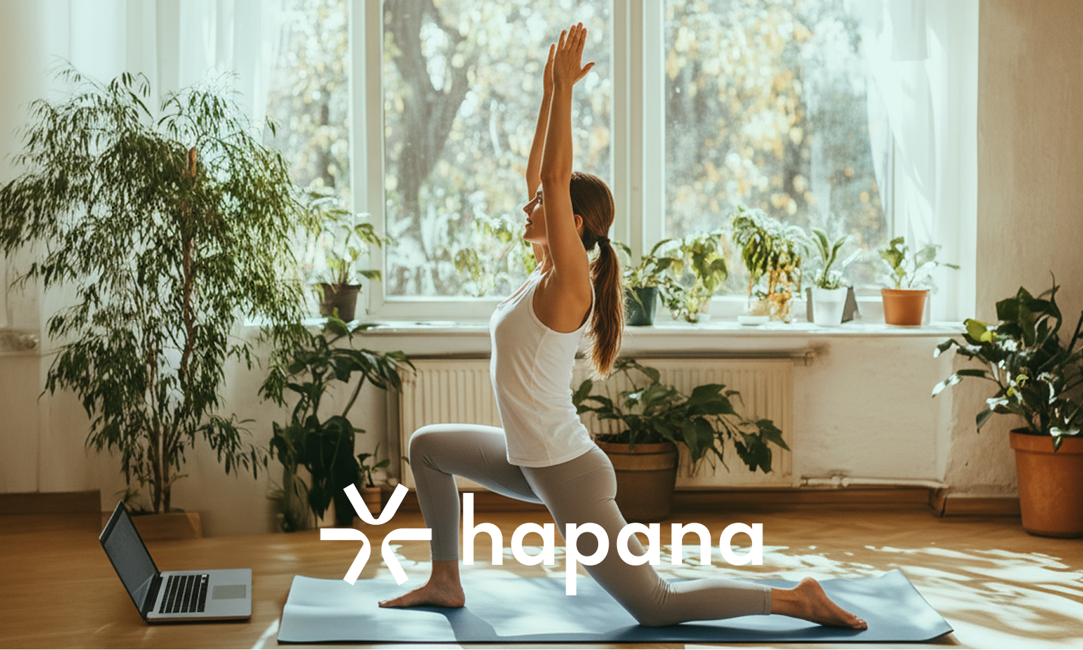 Woman going virtual yoga class on her laptop