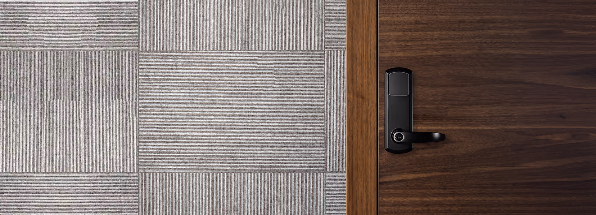 TownSteel Genius lock in flat black on wooden door and gray wall
