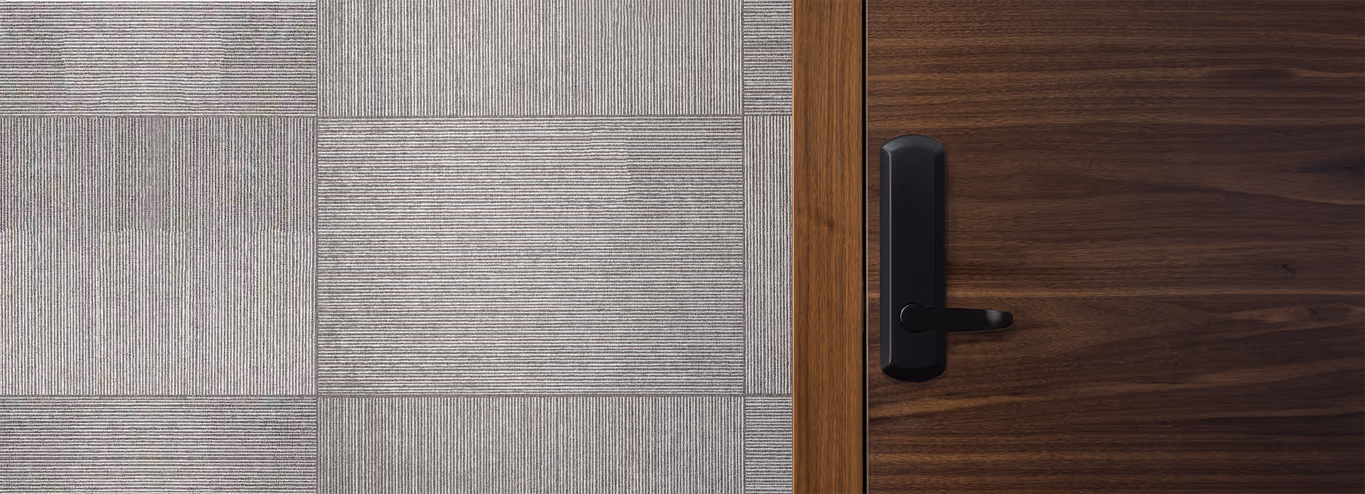 TownSteel Genius lock in flat black on wooden door and gray wall