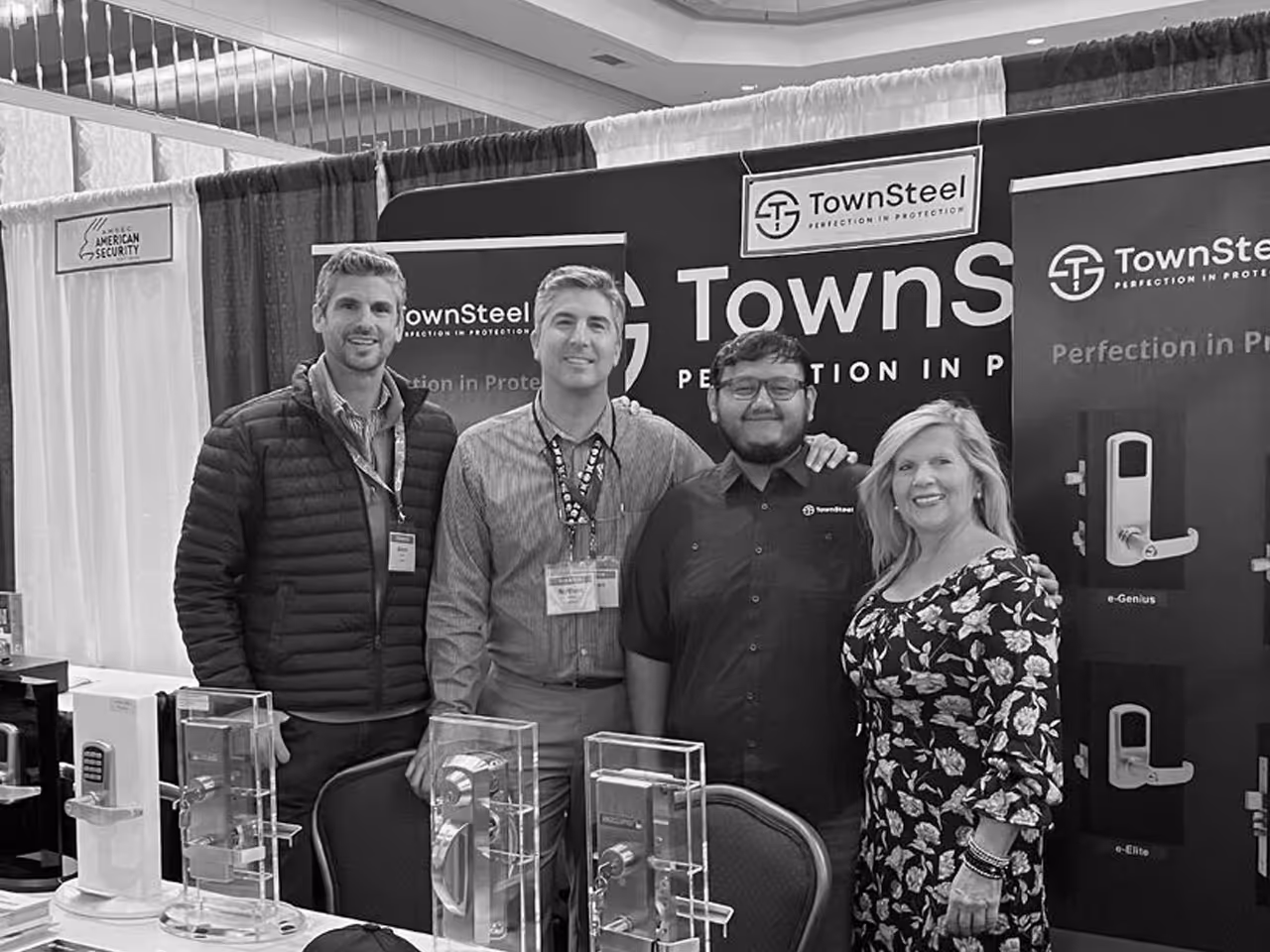 TownSteel booth showing sales representatives at a TownSteel booth with multiple locks on display.