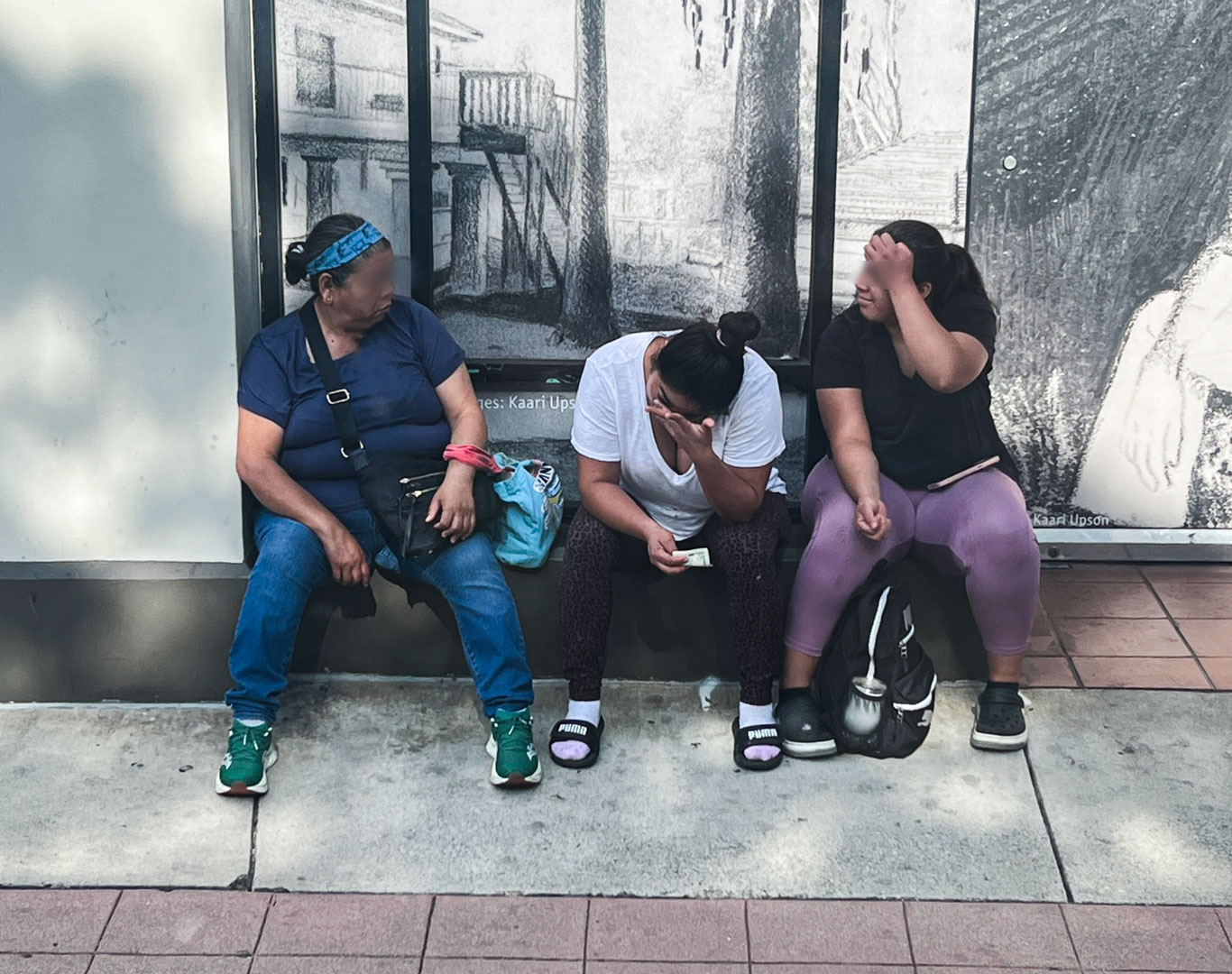 Lack of shelter and seating for people waiting for the bus.