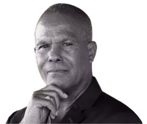 a man in a black shirt and tie