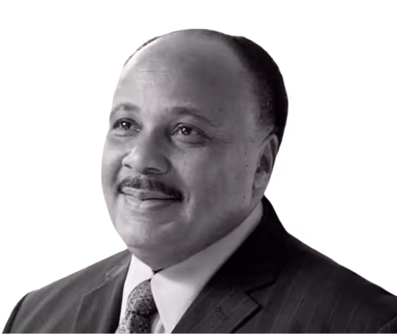 a man in a suit and tie with a green background