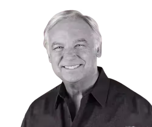 a man in a black shirt and white hair