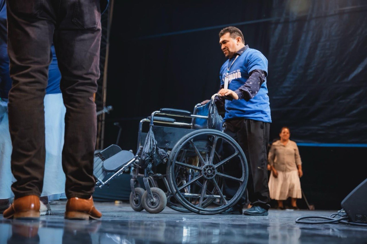 Healing at a crusade: an empty wheelchair on stage