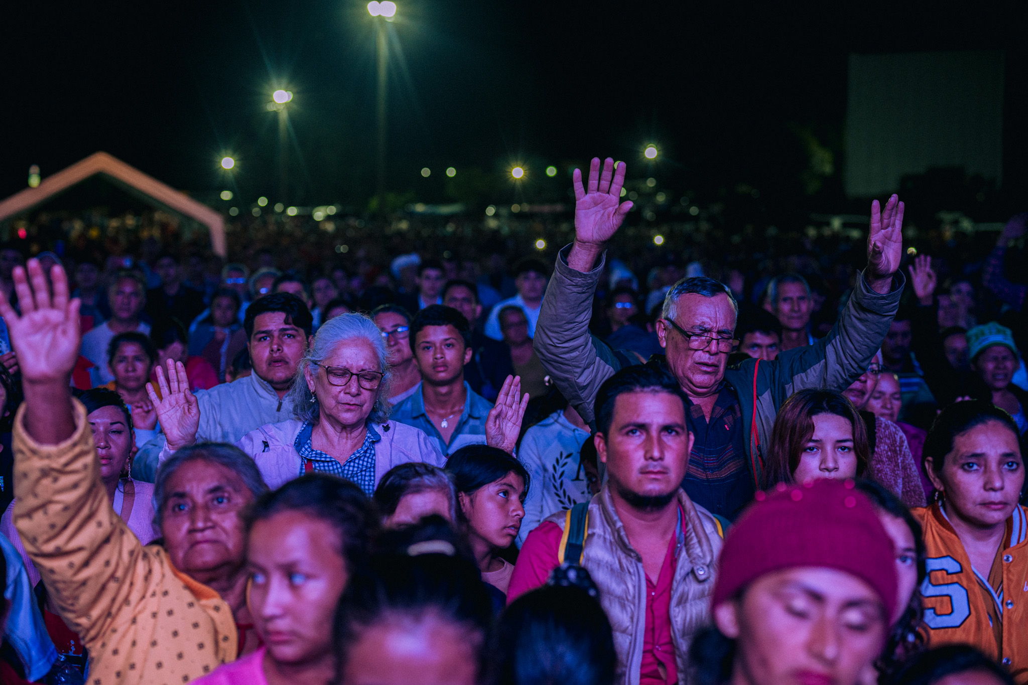 Believers worshiping at a crusade