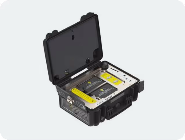 Open black rugged case device with control panel, buttons, and compartments inside, designed for technical or industrial use.
