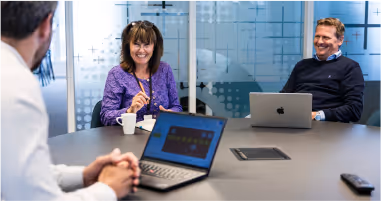 A team in the office discussing work processes