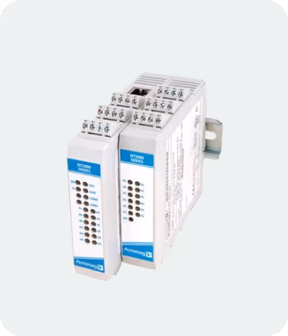 Two Acromag NTX2000 Series I/O expansion modules with terminal blocks and LED indicators, mounted on a metal rail.