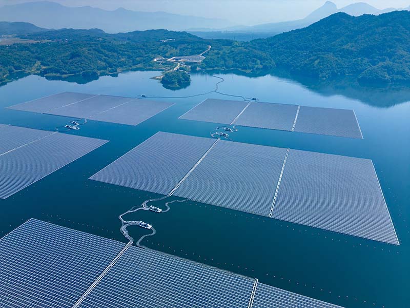 Ariel view of floating solar panels on a lake